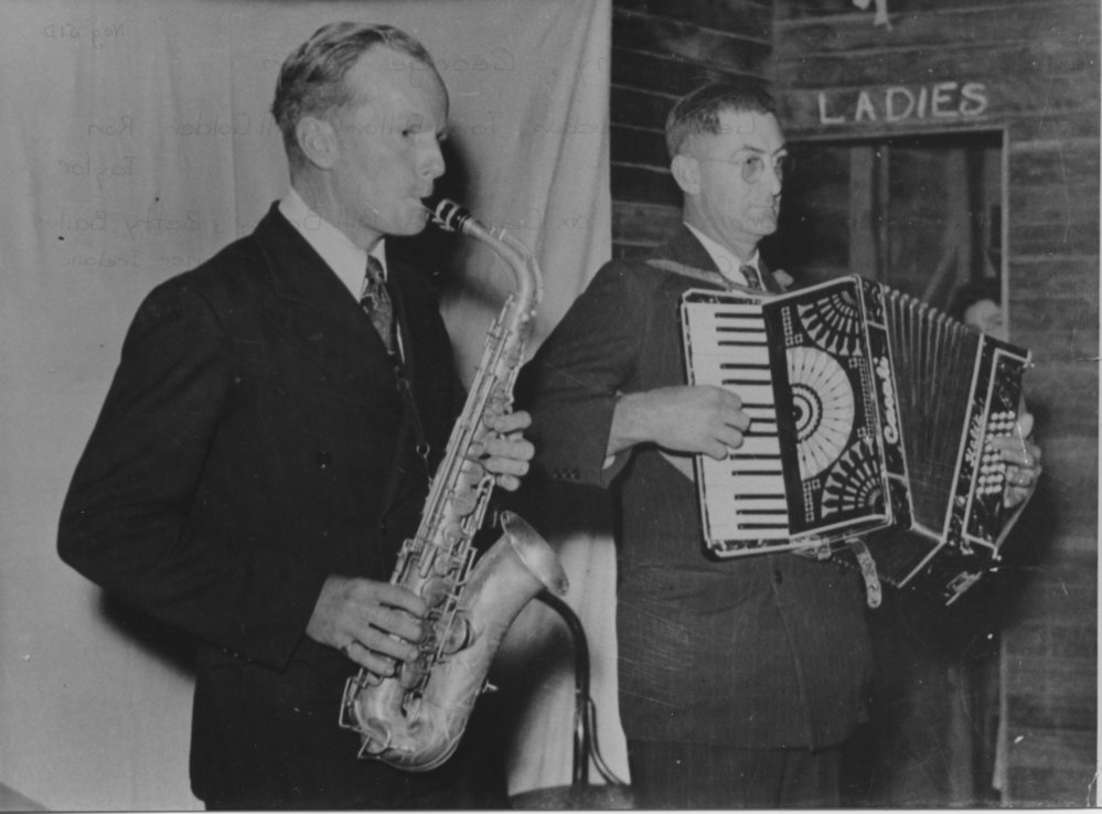 Col Irvine  on saxophone and Col Beavan with accordian performing in Bonville Hall, 1950 