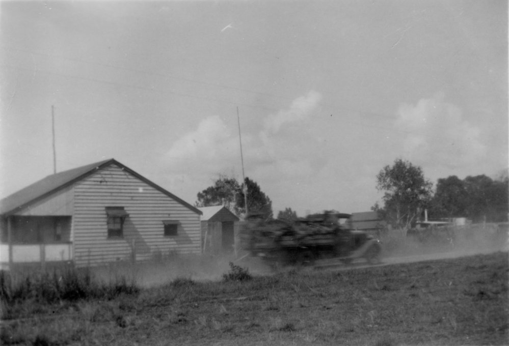 A truck passes a house in Sawtell, c. 1940