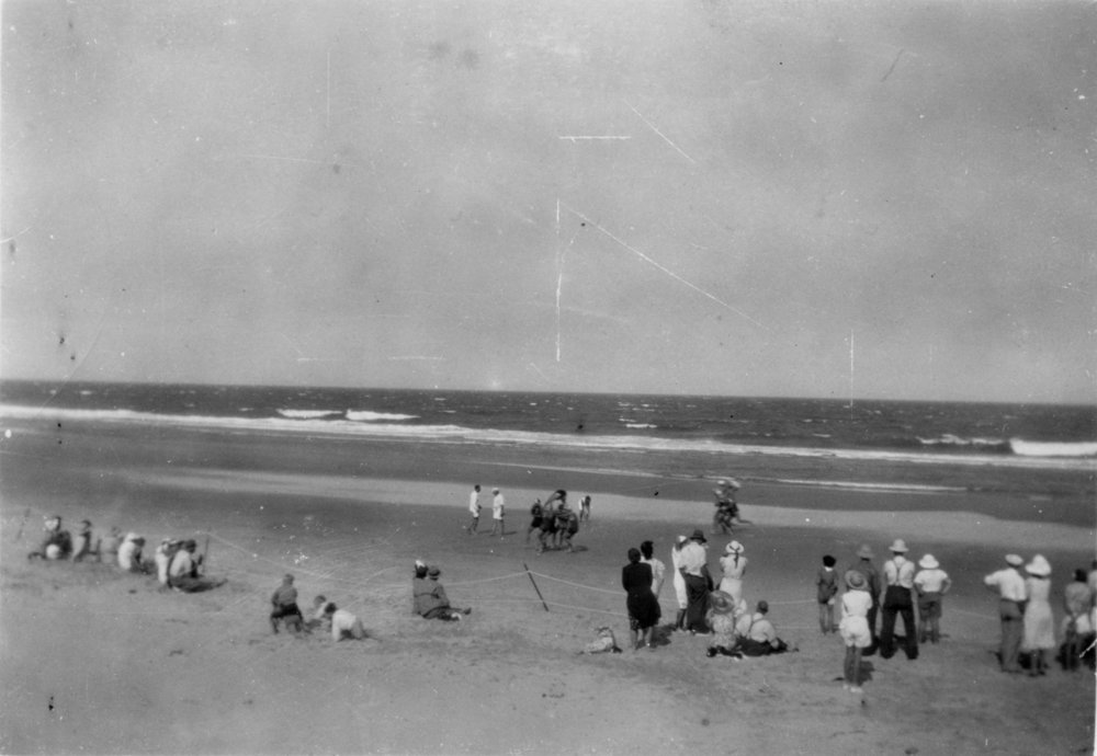 Spectators watching surf lifesavers competing on Sawtell Beach, c.1940