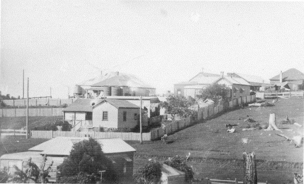 Timber houses with adjoining paddocks, 1930s
