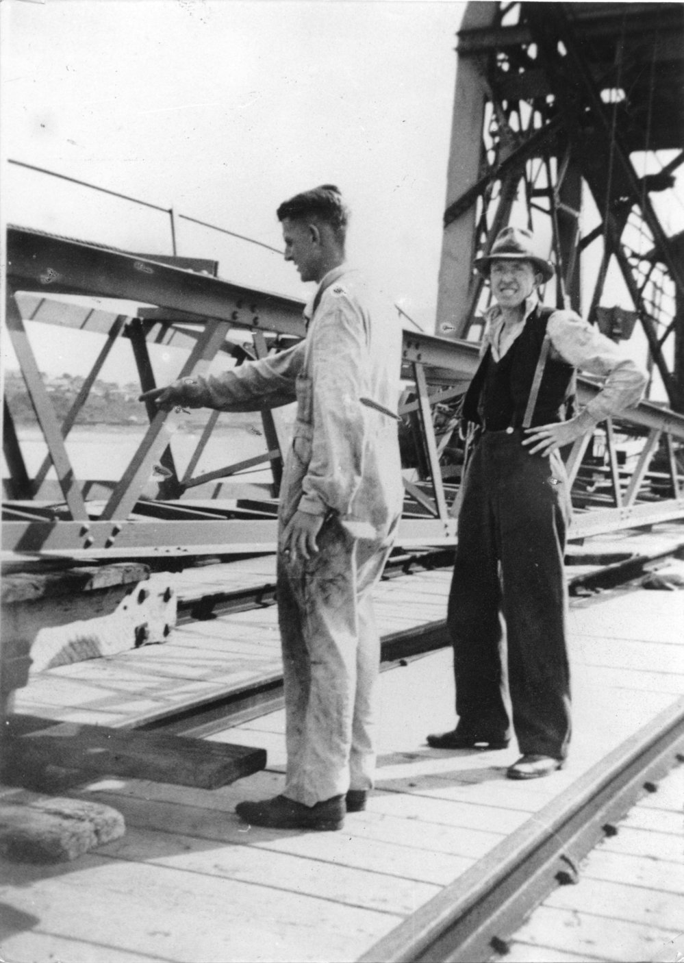 Public Works employees assembling crane 210 on Coffs Harbour jetty, mid 1940s