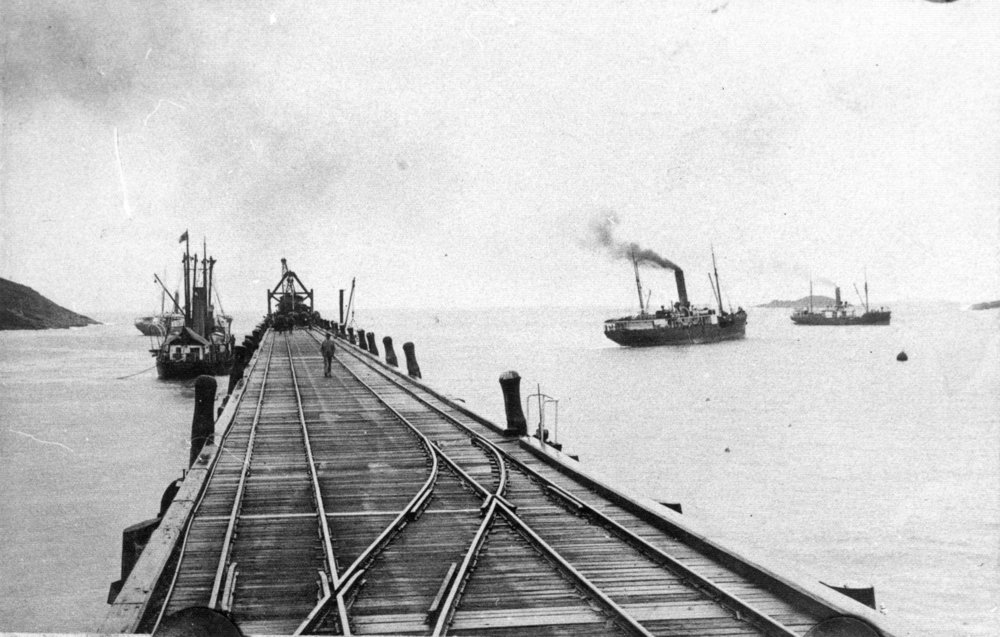Jetty railway tracks and steamships, c. 1920