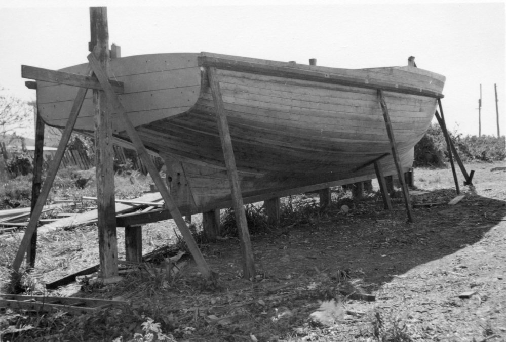 Harry Fanning building a launch, 1957