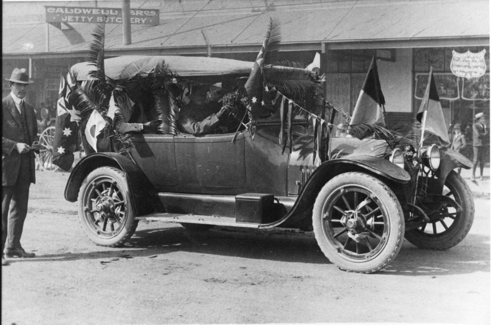 Decorated motor vehicle at Caldwell Bros' Jetty butchery, c. 1920