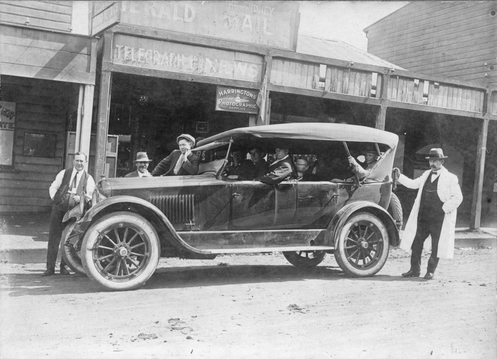 Coffs Harbour to Grafton Passenger Car in front of Hardy's Newsagent, c.1920