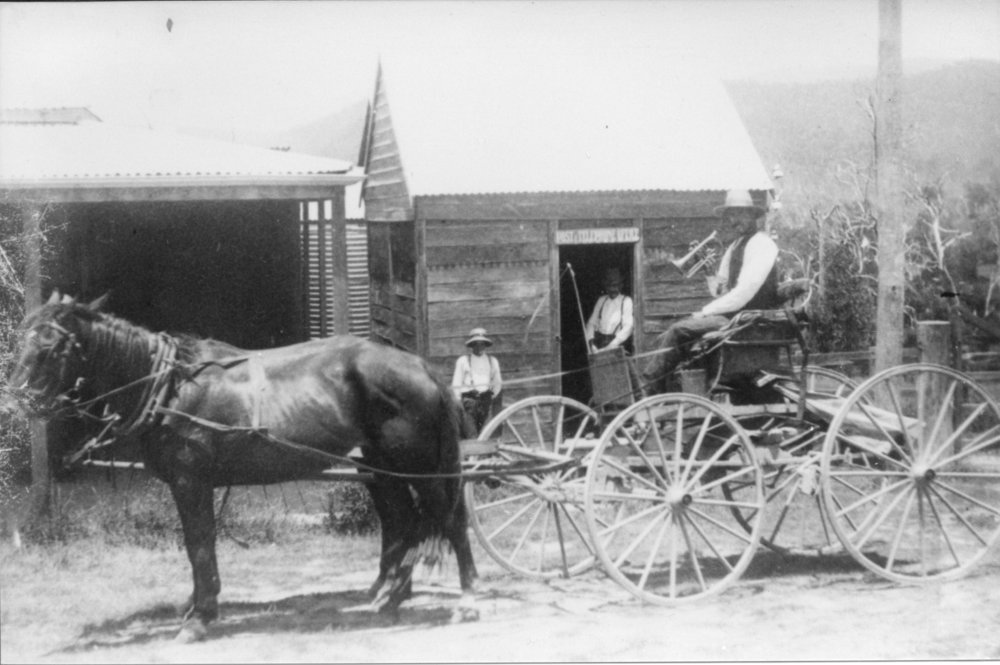 Mailman George Geddes and his bugle announcing the arrival of mail, early 1900s