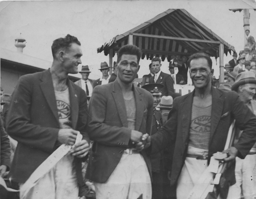 Champion woodchoppers Leo Appo, Whata Green and Mannie McCarthy at the Royal Easter Show, ANZAC Day 1930 