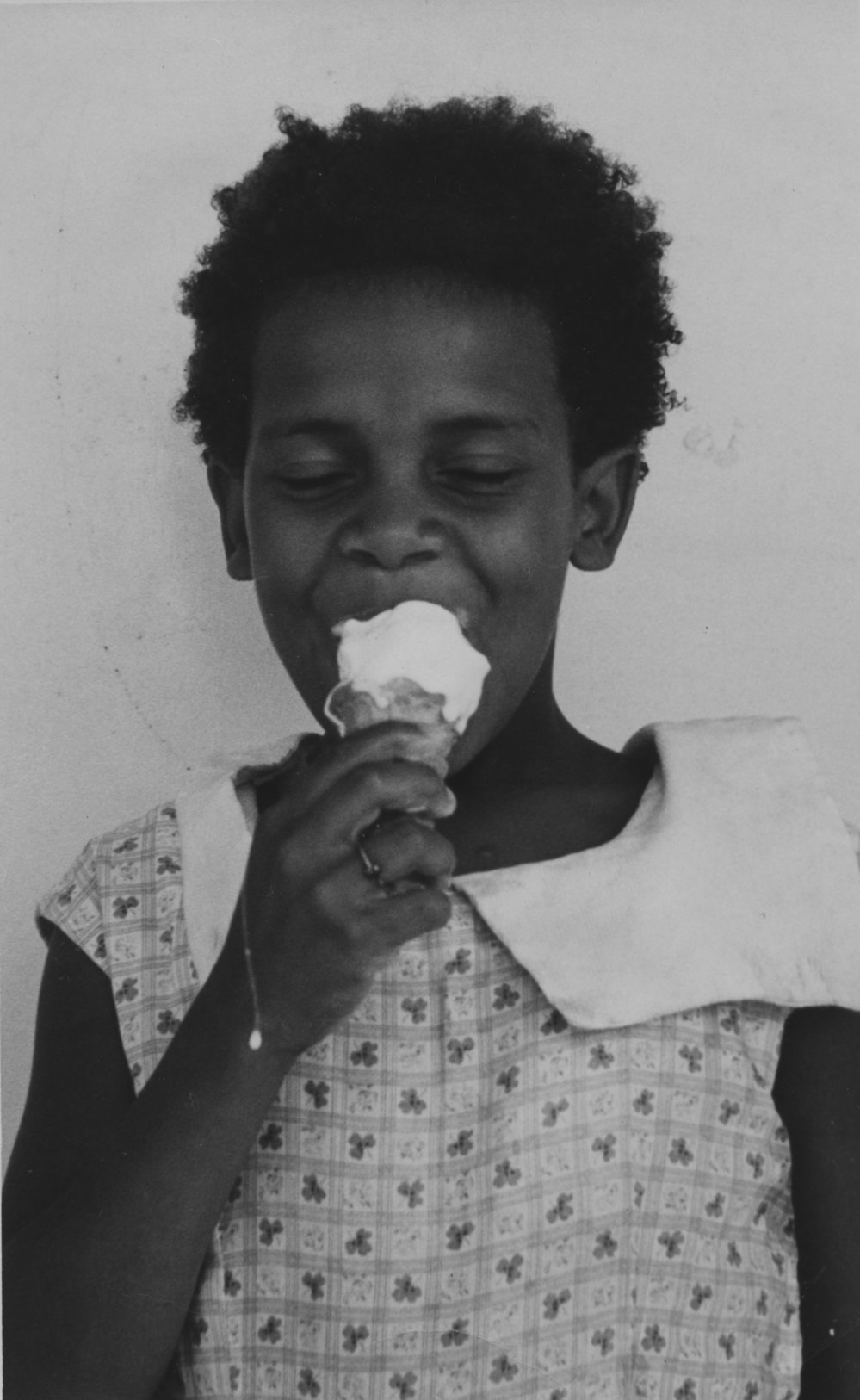 Portrait of Susan Dodds eating an icecream, c.1960s