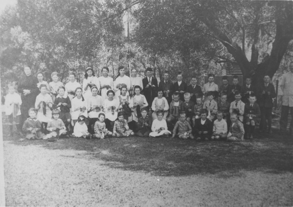 Pupils and teachers of Dunvegan School knitting for World War I soldiers, 1914-1918 