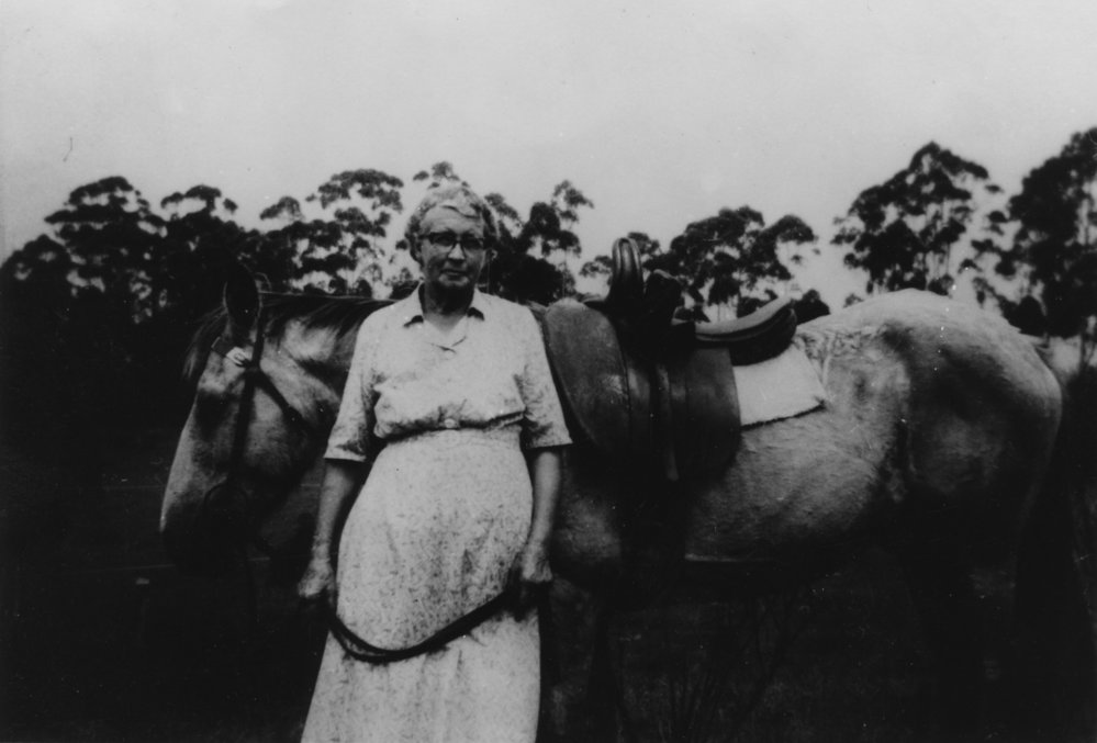 Portrait of Ethel Pade and horse with a side-saddle, c.1940s