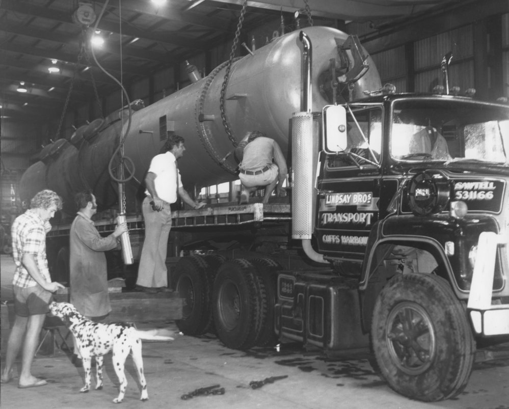 Heat exchanger being loaded onto a Lindsay Bros' truck at W. E. Smith's factory, 4 March 1976