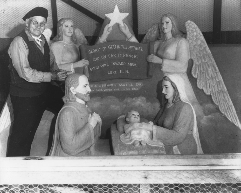 John Suchomlin with his sand models carved at Sawtell Reserve, 1962 