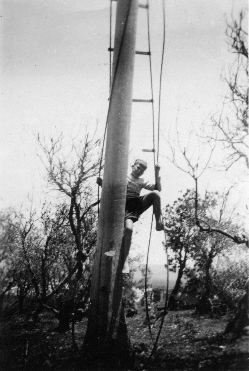 Richard Morgan climbing a signal station mast, 16 January 1953 