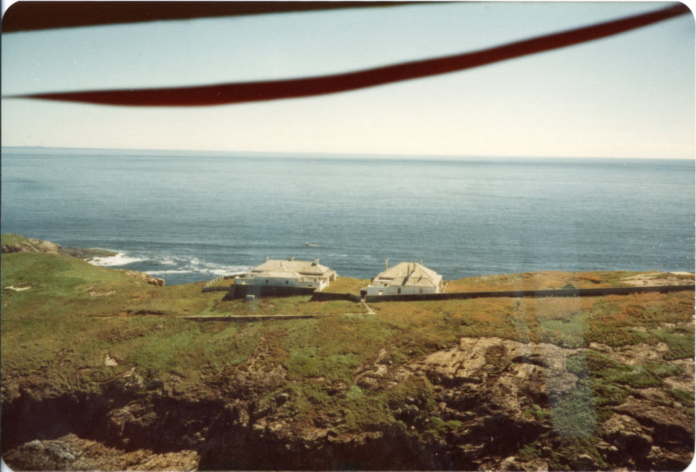 Aerial view of the lightkeepers' cottages on South Solitary Island, 1980