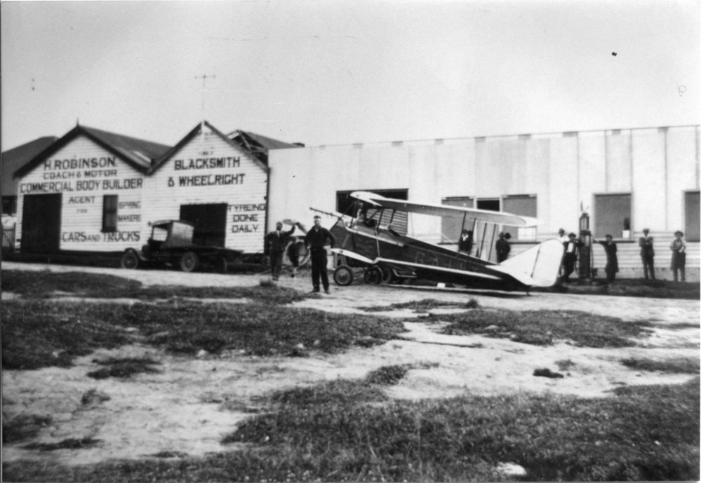 A Gypsy Moth aeroplane outside Harry Robinson's repair shop, 5 September 1928