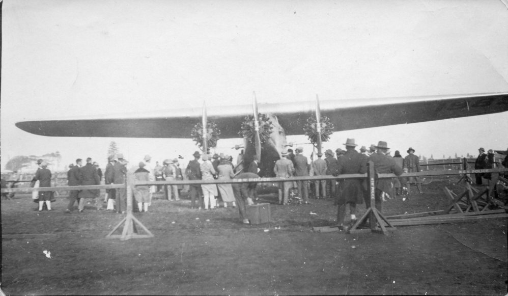 Charles Kingsford-Smith's aeroplane 'Southern Cross' with spectators, 9 June 1933 