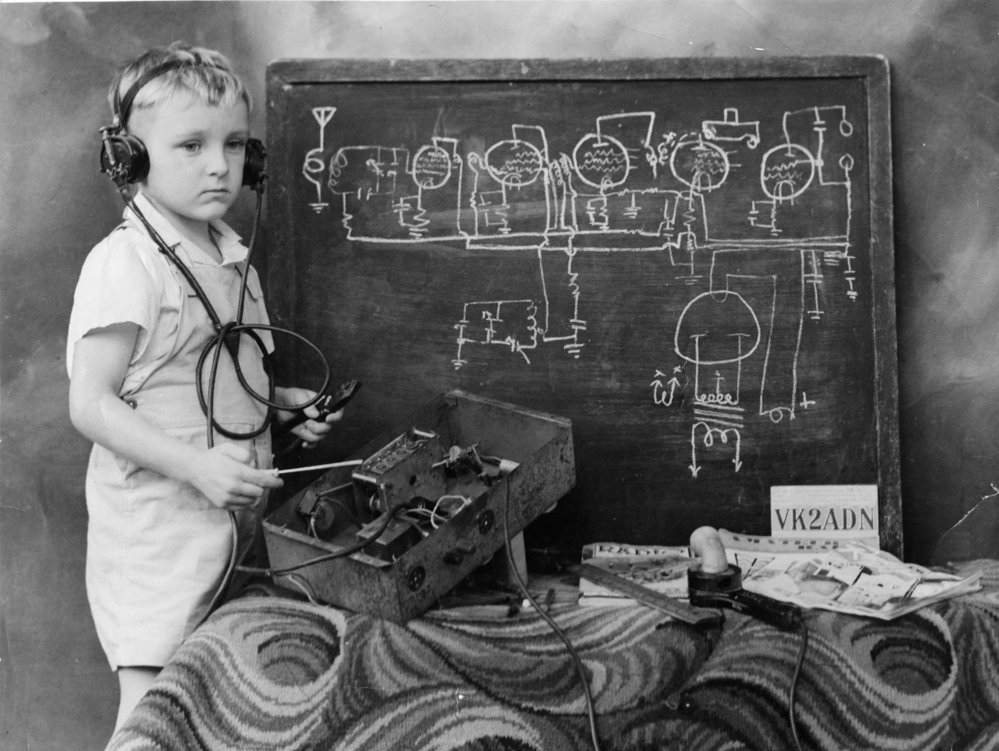 Portrait of Ian Hamey with circuit diagrams, 1949