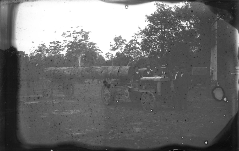 Log hauling demonstration with timber-wheeled tractor, 1912