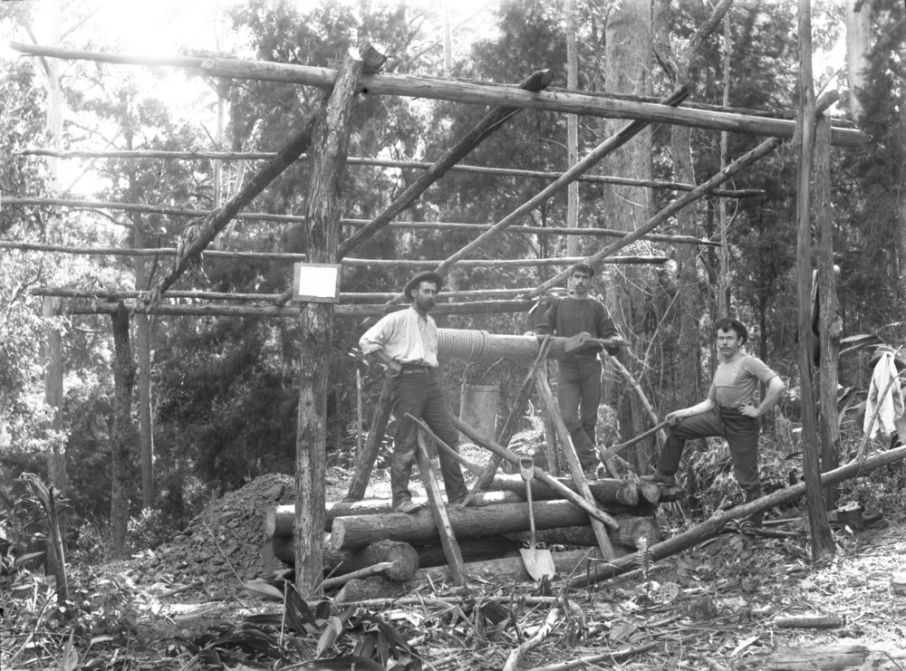 Three men at a Beacon Mine entrance, c. 1898