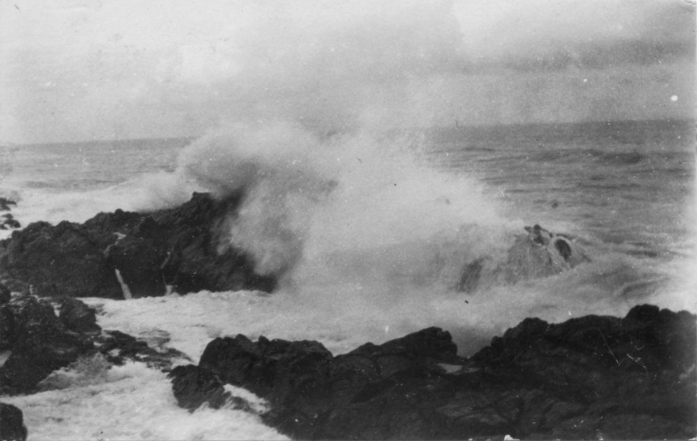 Waves breaking over rocks, c.1912