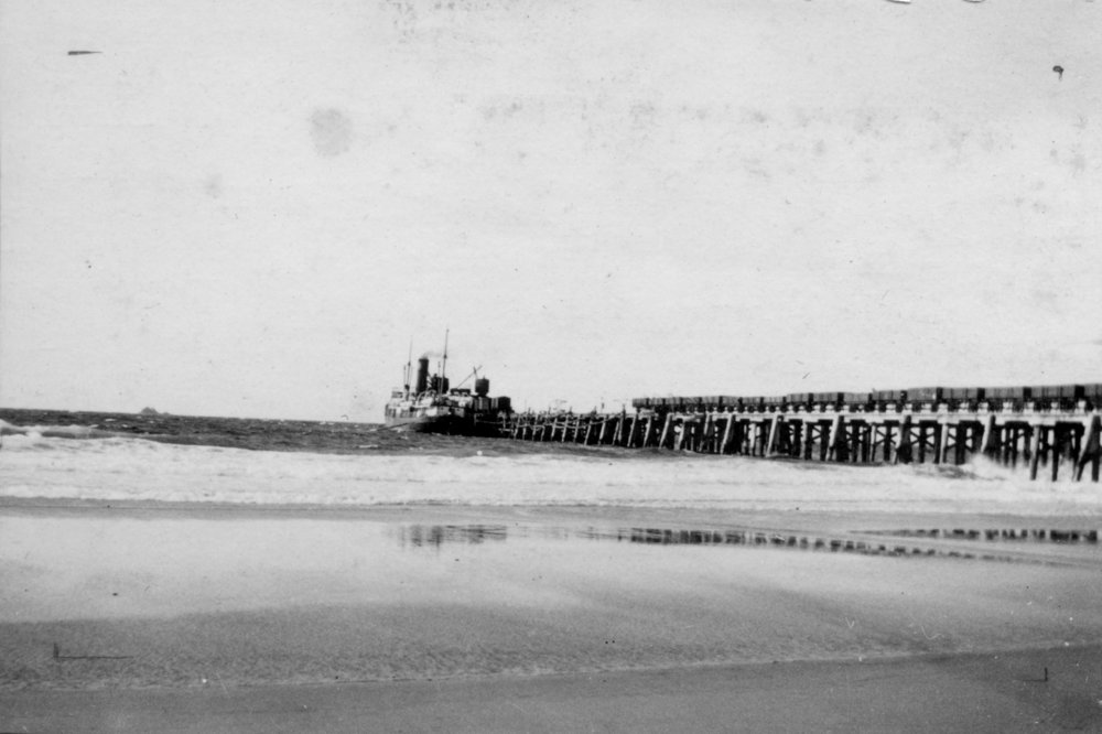 A ship docked at Byron Bay jetty, c.1912