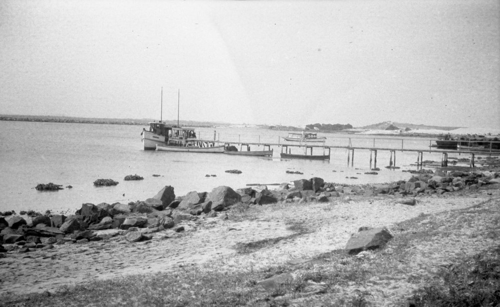 Fishing boat moored at the jetty, c.1925