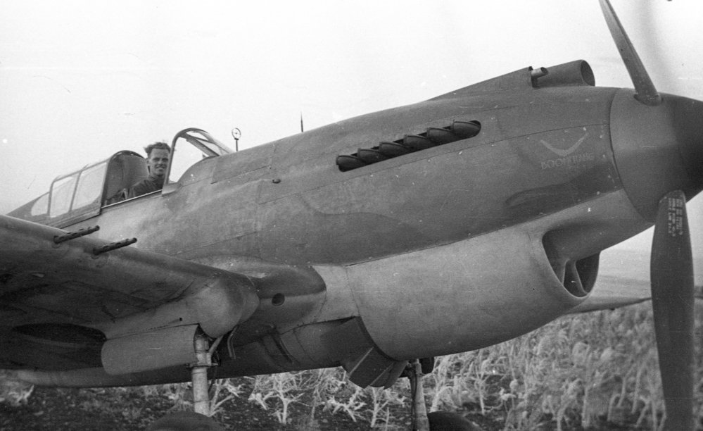 A pilot in the cockpit of an RAAF Tomahawk Boomerang fighter, c.1942