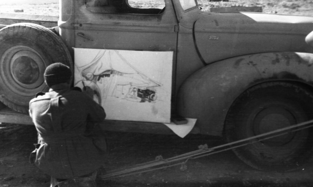 Airman Alan Munro sketches against a utility, 1941