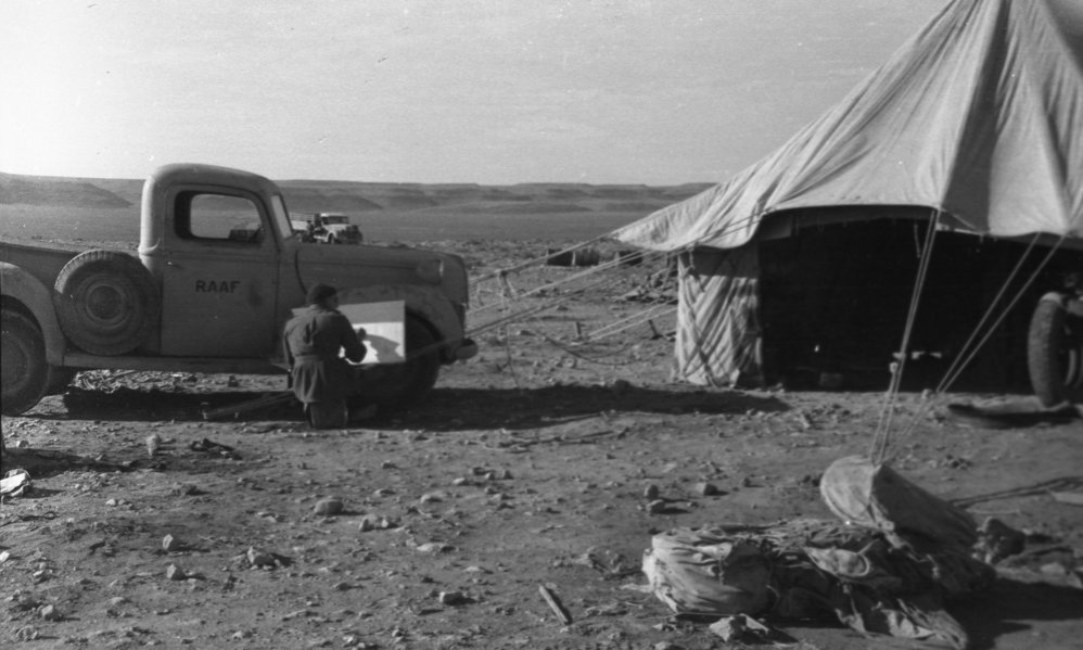Airman Alan Munro sketching a tent, 1941
