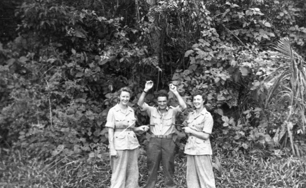 Two Australian nurses hold up Leonard Black, c.1944