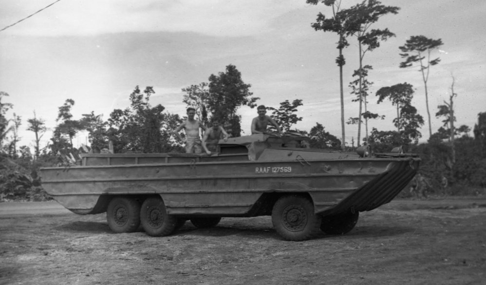 Three soldiers with R.A.A.F. army duck 127569, 1945