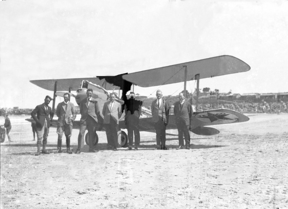 Texaco plane on Jetty Beach with members of the Aero Club, c. 1926