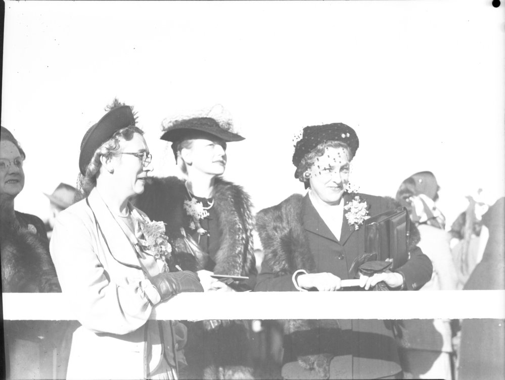Three well dressed ladies at the Coffs Harbour Racing Club's inaugural meeting, 7 August 1948