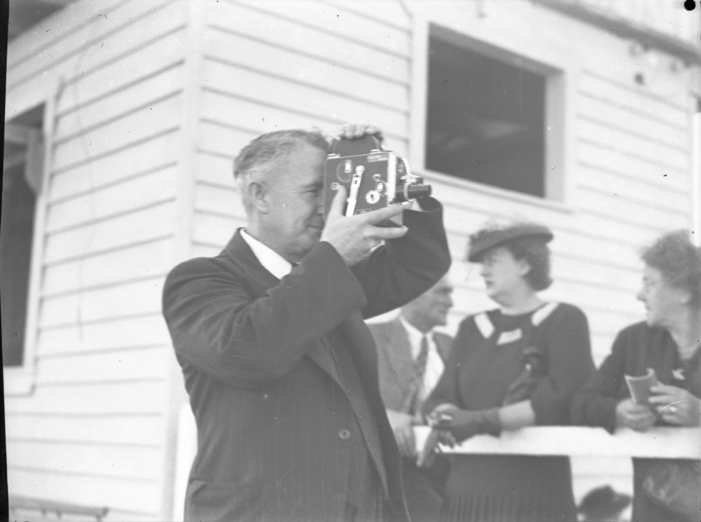 Jack Gerard filming at Coffs Harbour Racing Club's inaugural meeting, 7 August 1948