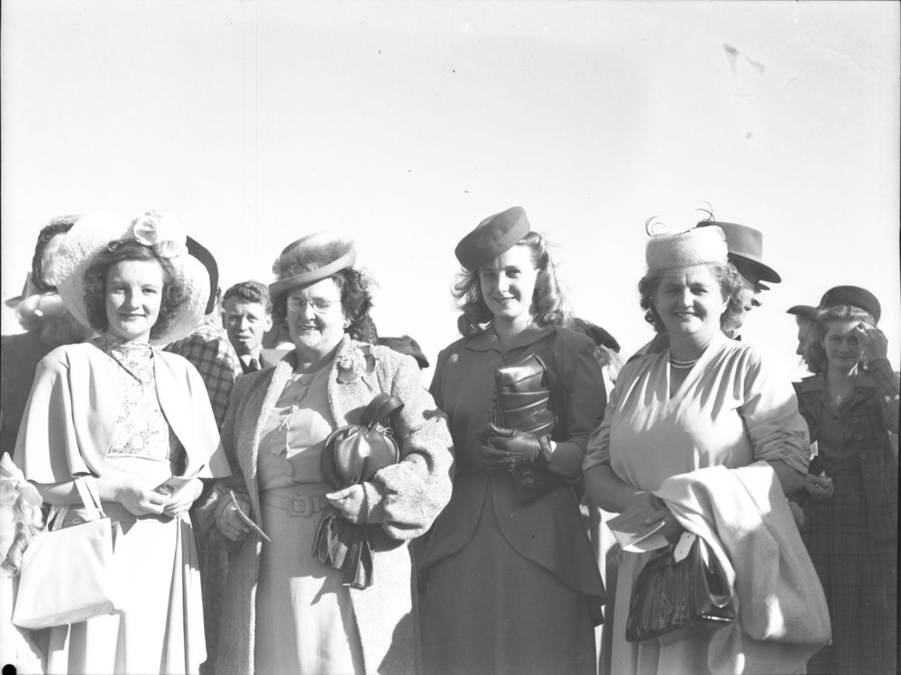 Four well dressed ladies at the Coffs Harbour Racing Club's inaugural meet, 7 August 1948