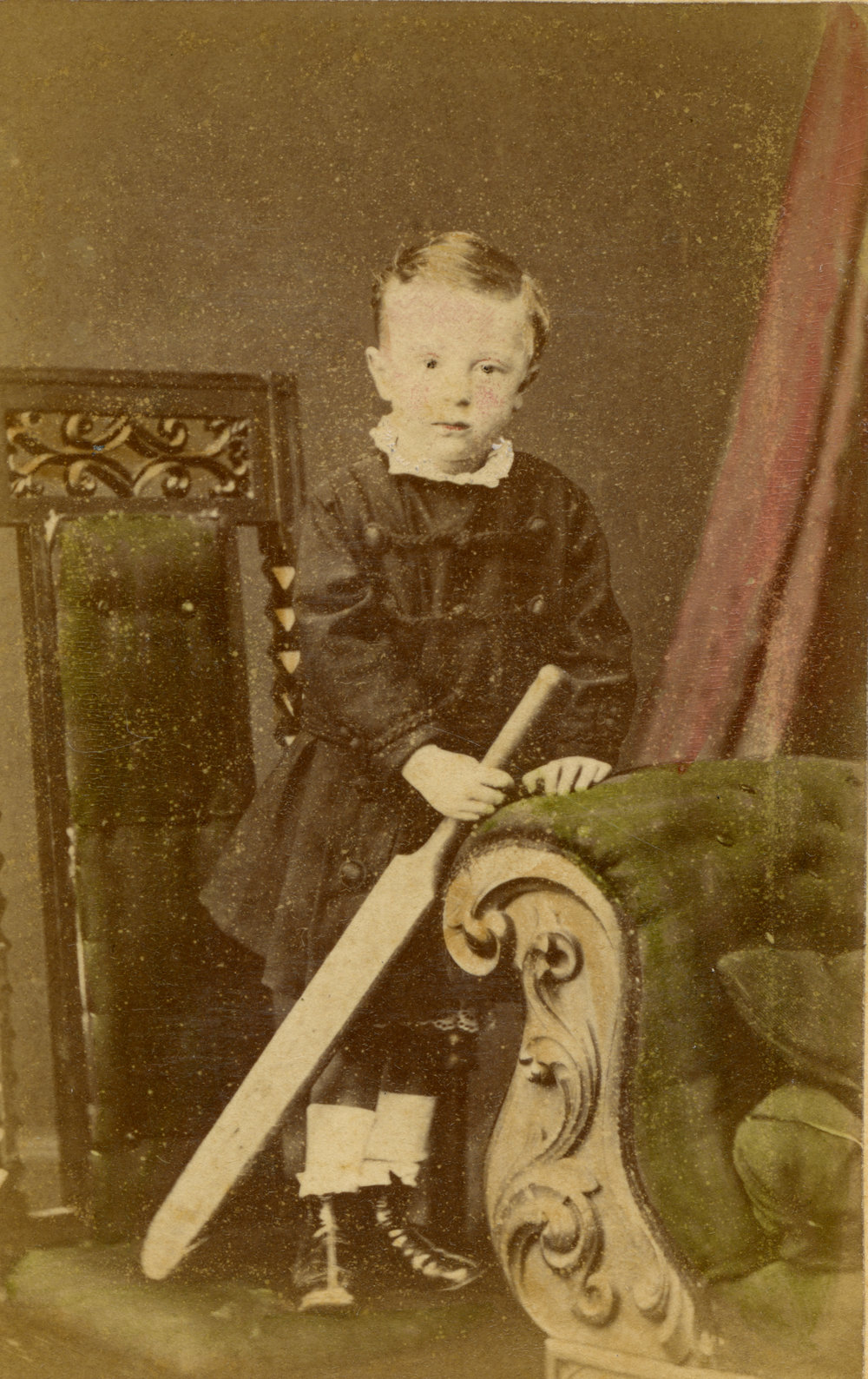 Portrait of a young boy with cricket bat, c. 1877