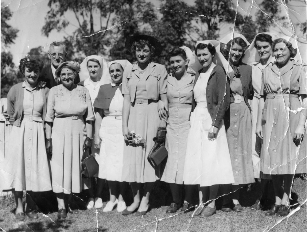 Mayor Cecil Vost and Marjorie Jackson with staff of the Sunnyside Maternity Hospital, 25 August 1952