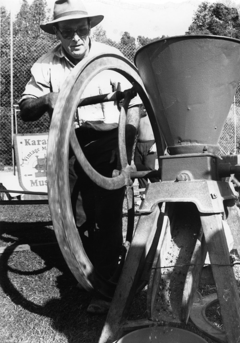 Doug Hoschke demonstrates how to use a corn cracker at the Orara Valley Fair, 10 June 1992 