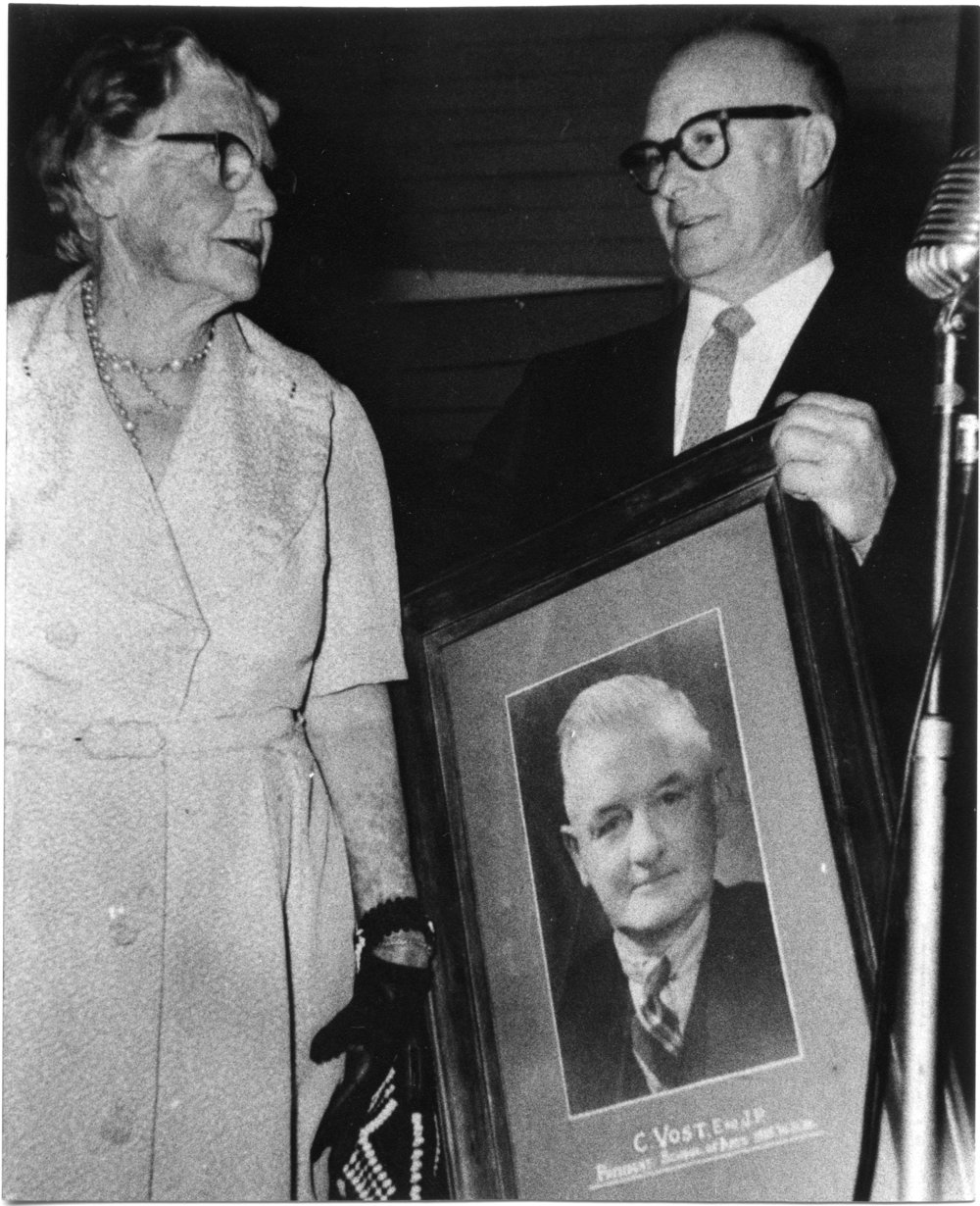 Lottie Vost receives a portrait of her late husband Charles on the closure of the School of Arts, 13 October 1961