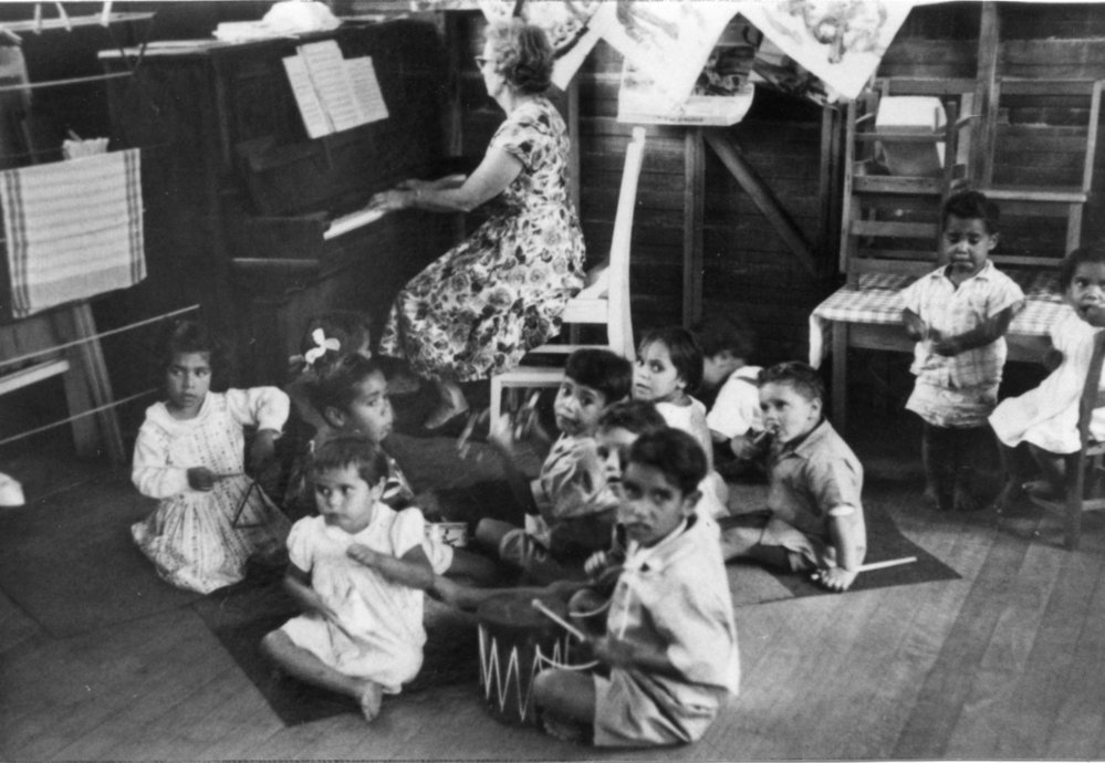Mrs Marj Smith with a Save The Children Fund pre-school music class
