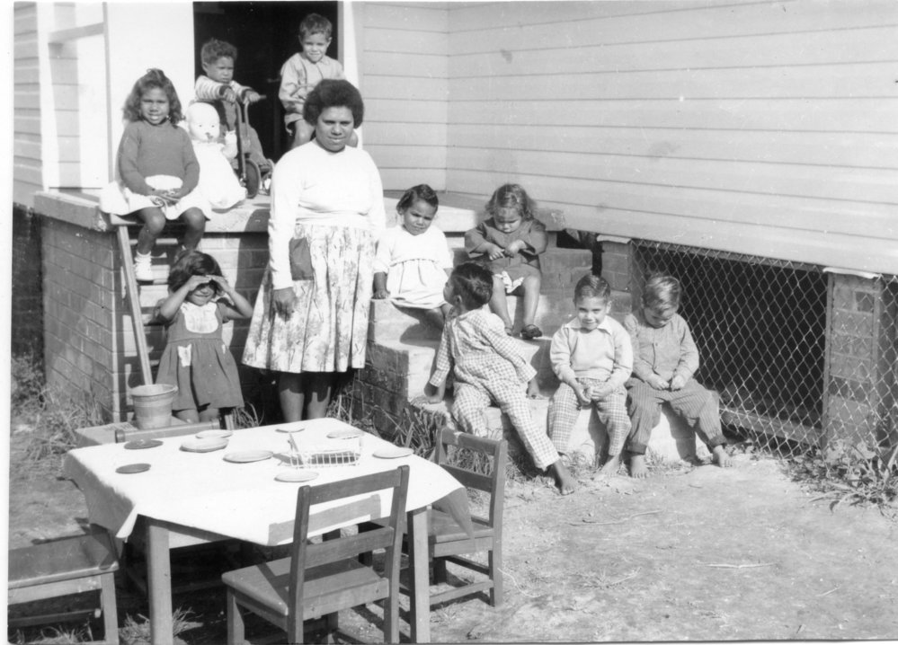 Assisting teacher Shirley Wilson with some children at the Mission, c.1962