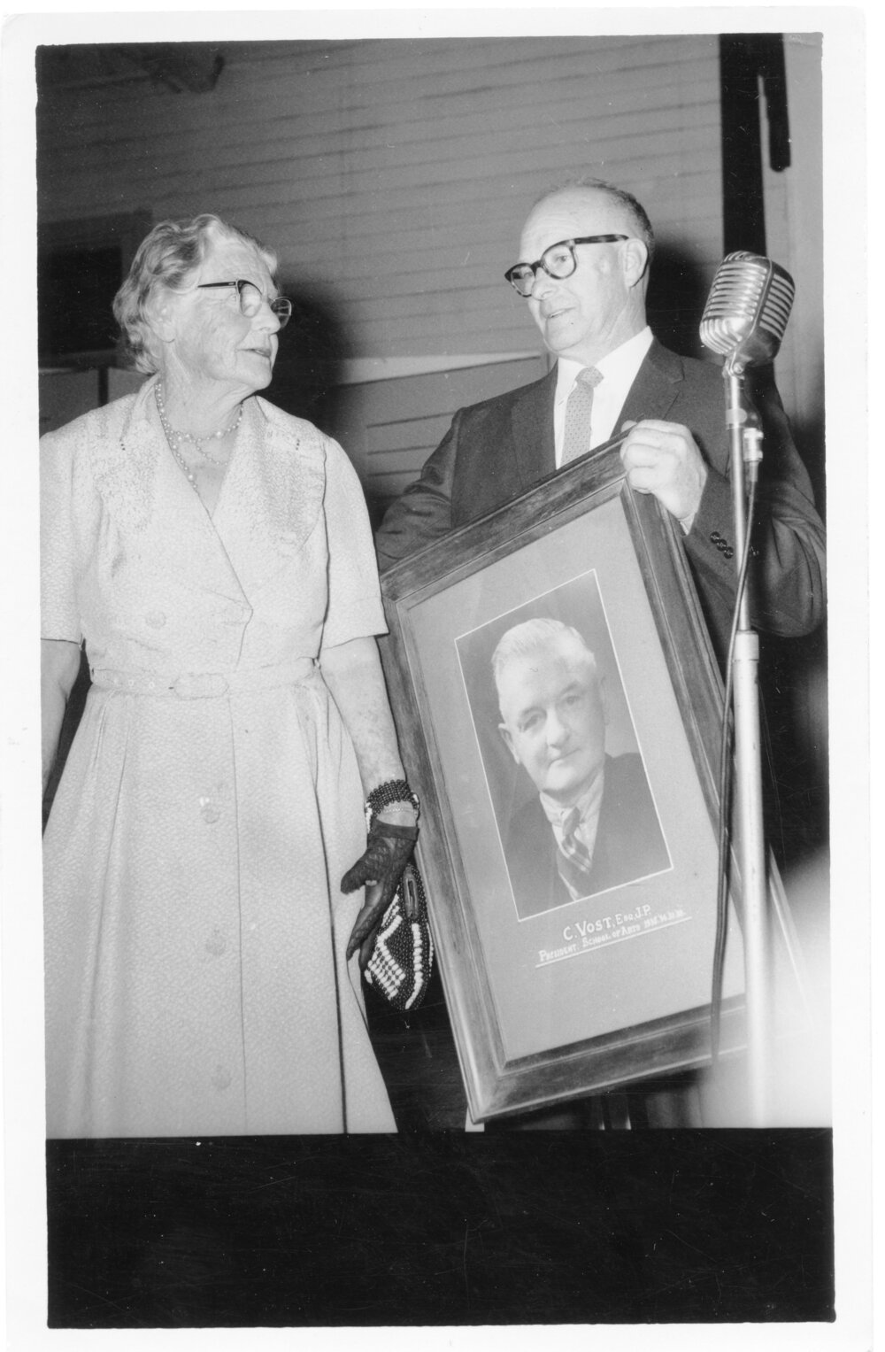 Lottie Vost and Charles Gilbey with Charles Vost's portrait, 13 October 1961