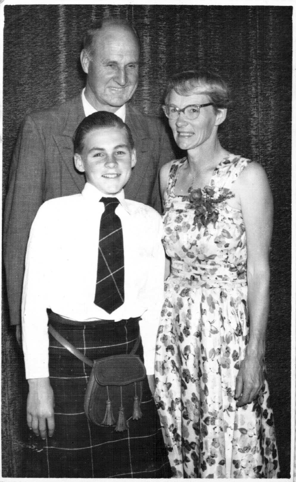 Hugh with his parents David and Betty Nicol at the Scottish Ball, 1950s 
