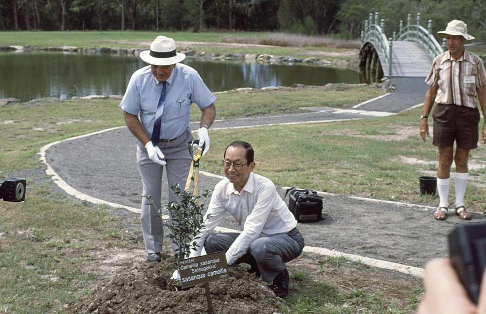 Sasebo sister city visitors planting tree in the North Coast Regional Botanic Garden