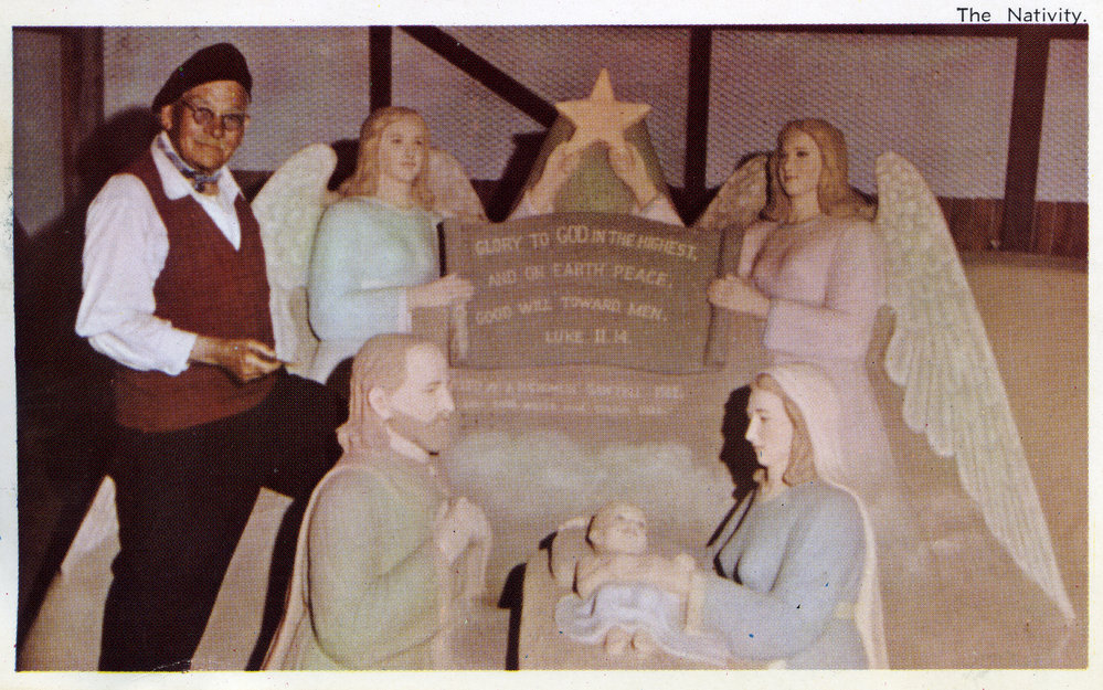 Sand modeller John Suchomlin with his sculpture, 1962