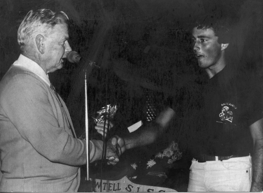 Life member Bill Woods presents the Clubman Award 1980-1981 to Brett Fields, 1981