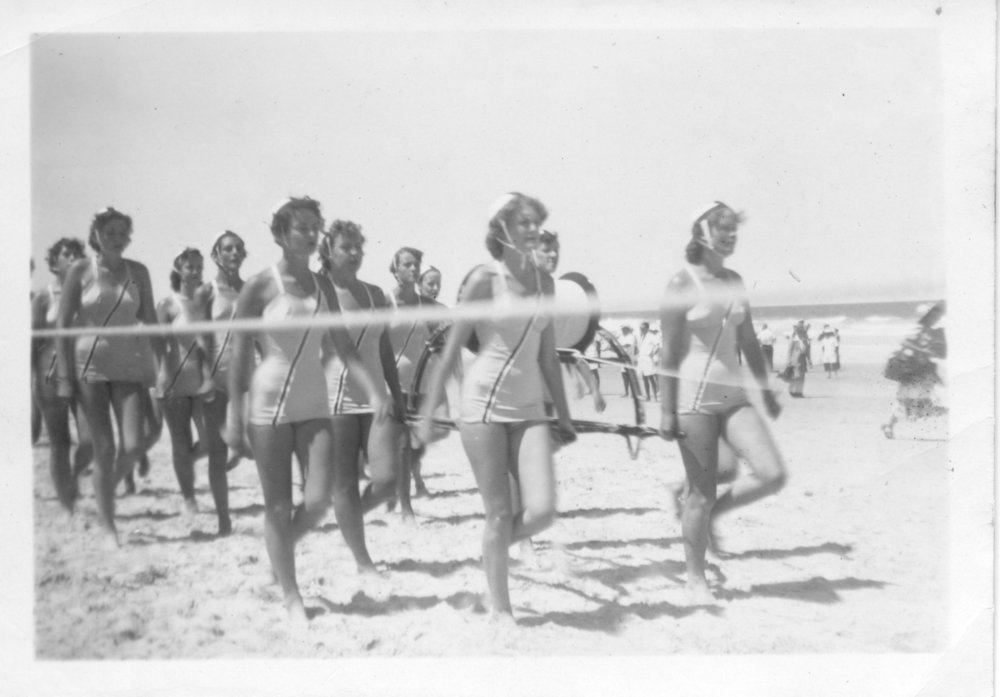Sawtell Life Savers Surf Club ladies march past, 1958 