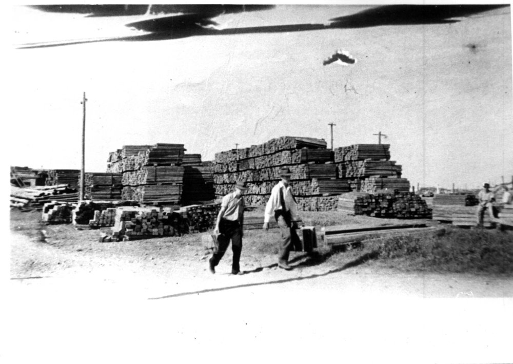 Timber stacked and ready for shipment at Coffs Harbour Jetty, early 1900s 