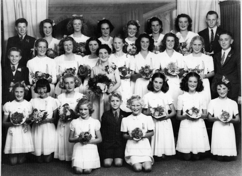 Eileen Keeley with her music pupils after their annual recital, 1950s