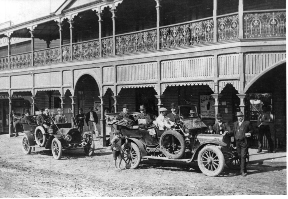 Cars and passengers parked in front of the Pier Hotel on Ocean Street, early 1900s